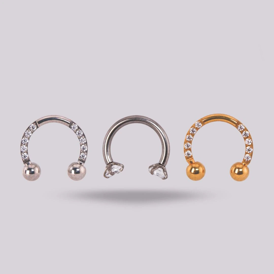 Joya herradura zircon