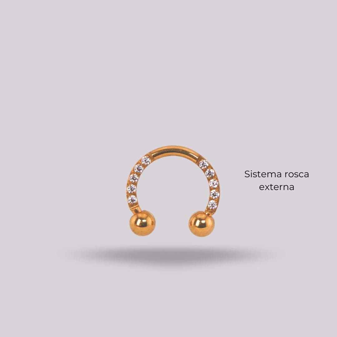 Joya herradura zircon